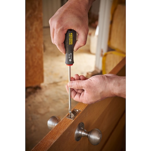 STANLEY® FATMAX® Slotted Flared 6.5 x 150mm Screwdriver Application Action Shot Hand/Person