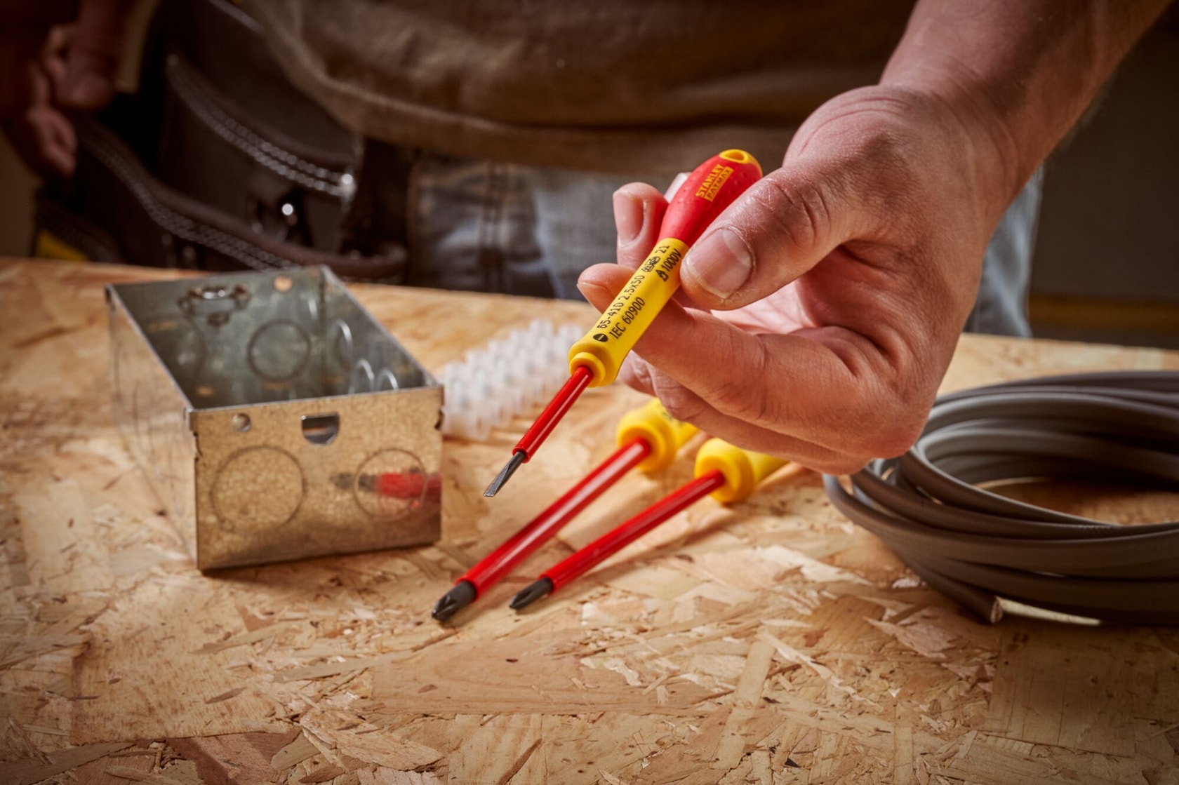 STANLEY® FATMAX® Insulated Slotted 2.5mm x 50mm Screwdriver Application Action Shot Hand/Person